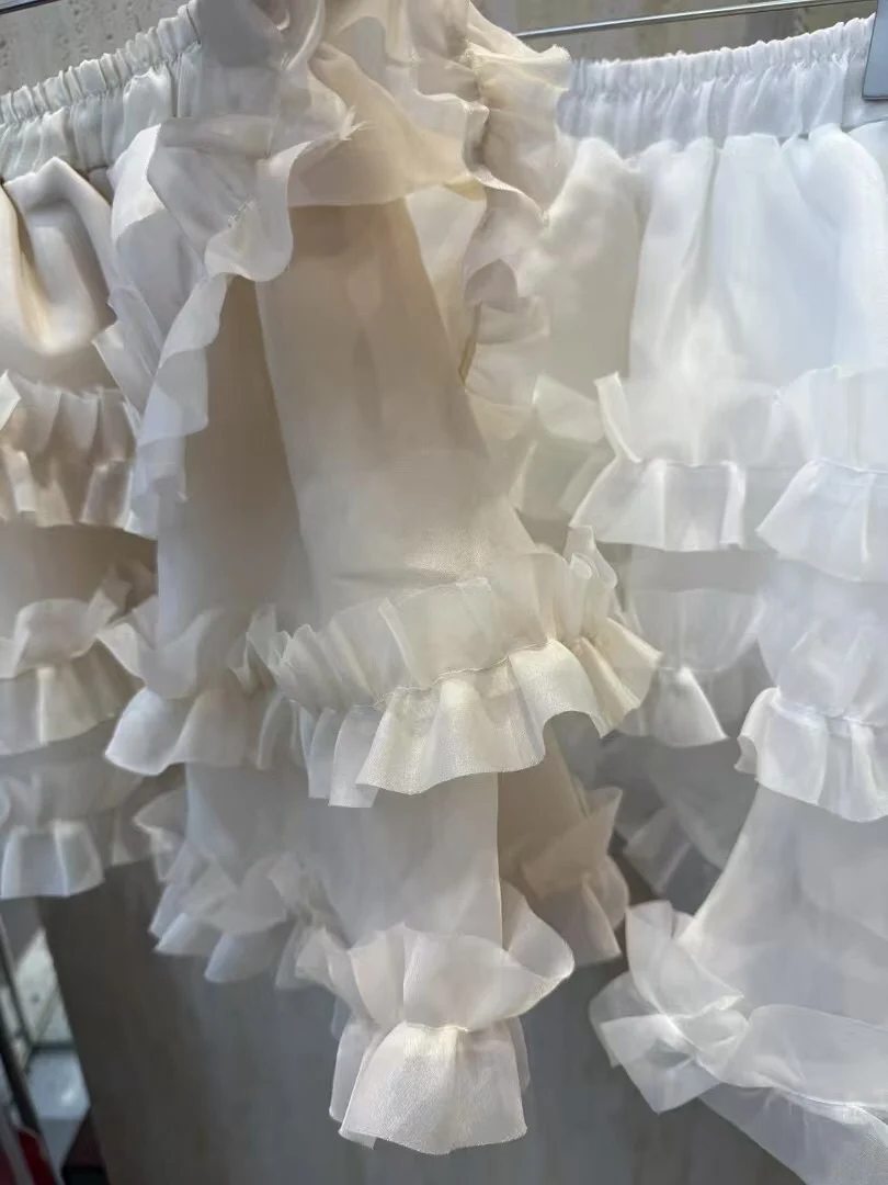 ربيع 2025 المرأة مرونة الخصر رقيق f تنورة كعكة ort تنورة السراويل أجراس خشبية عالية الخصر الحلو Sle ort طول