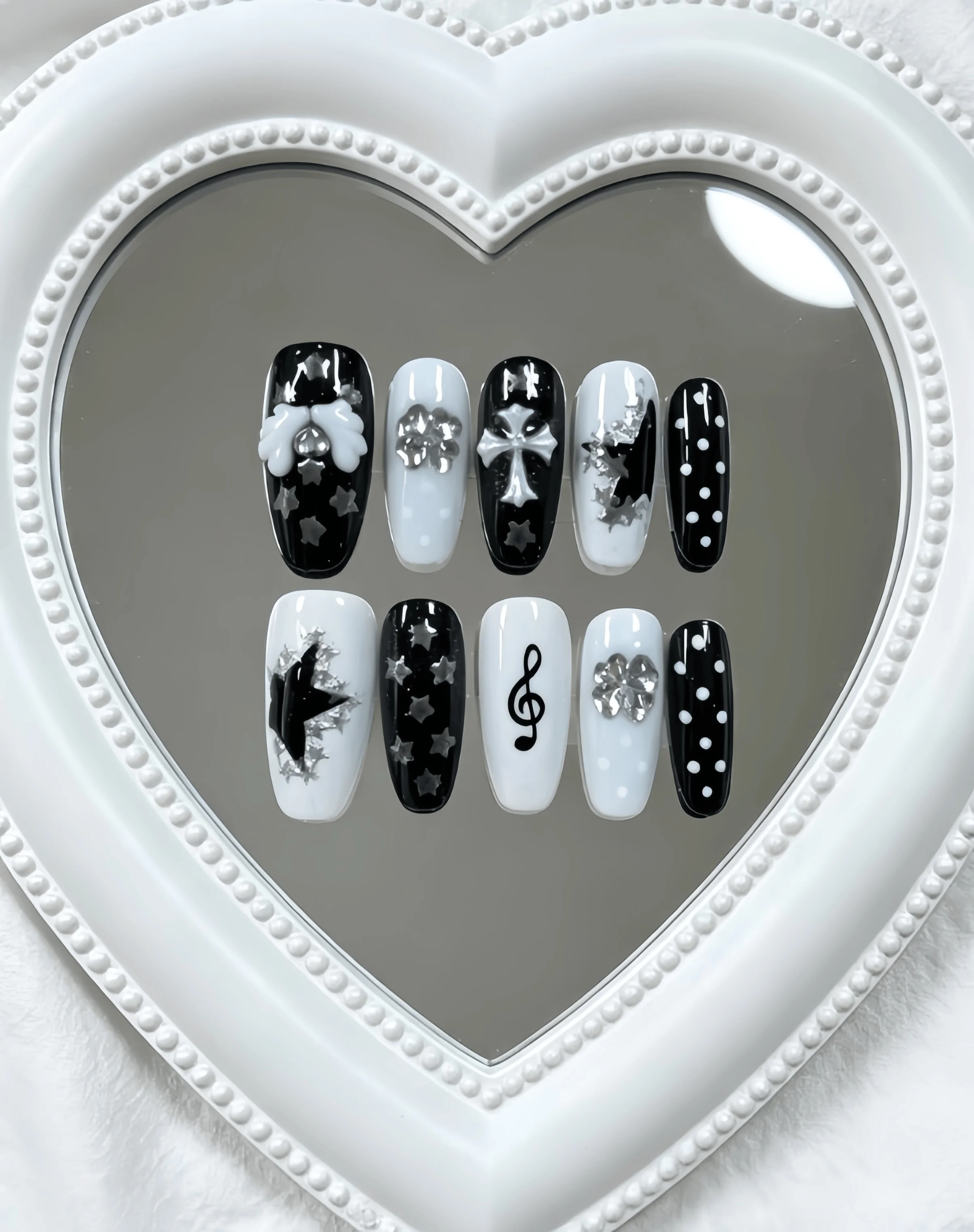 10 Medium-Length Coffin-Shaped Press-On Nails, Black and White Color Scheme with Hand-Painted Stars, Polka Dots, 3D Bows, Crosses, Musical Notes, and Rhinestone Decorations, Y2K Sweet-Cool Style, Perfect for Girls, Unique Outfits, and Energetic Occasions, Comes with Jelly Glue and Nail File