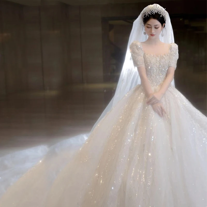 Abito da sposa con perline a maniche corte 2023 nuovo lusso grande treno abiti da sposa abito da ballo in tulle abiti da sposa Vestido De Noiva