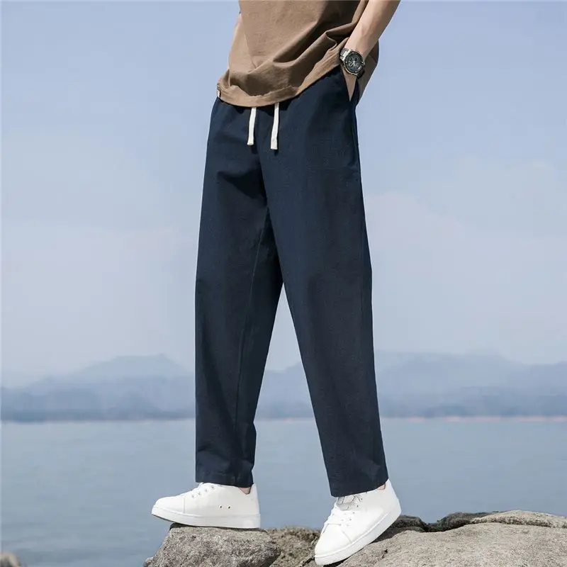 Frühling Herbst neue Mode Baumwolle Hanf einfarbig elastische Herren bekleidung Taille lässig Tasche Kordel zug Einfachheit gerade Hose