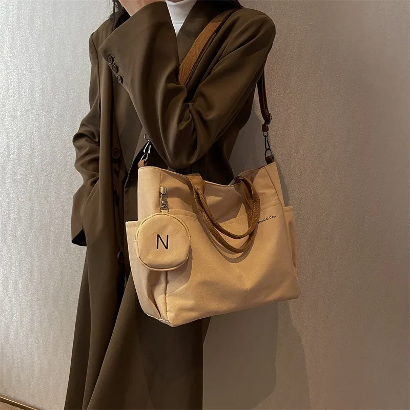 

Spring new Korean-style casual fashionable canvas tote bag for women, shoulder crossbody bag for commuting.