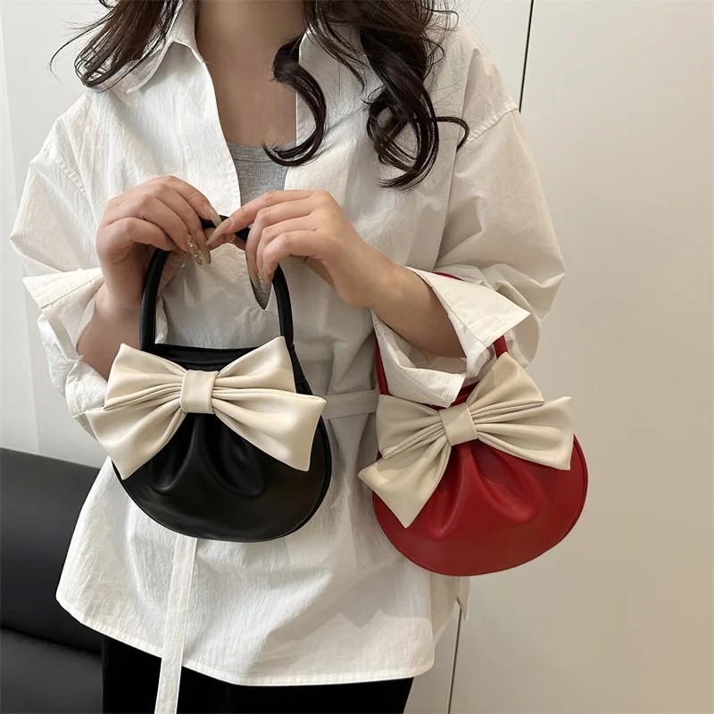 حقيبة ركاب بتصميم فاخر للنساء لربيع وصيف 2025 حقيبة يد أنيقة حقيبة سرج على شكل فيونكة للسيدات