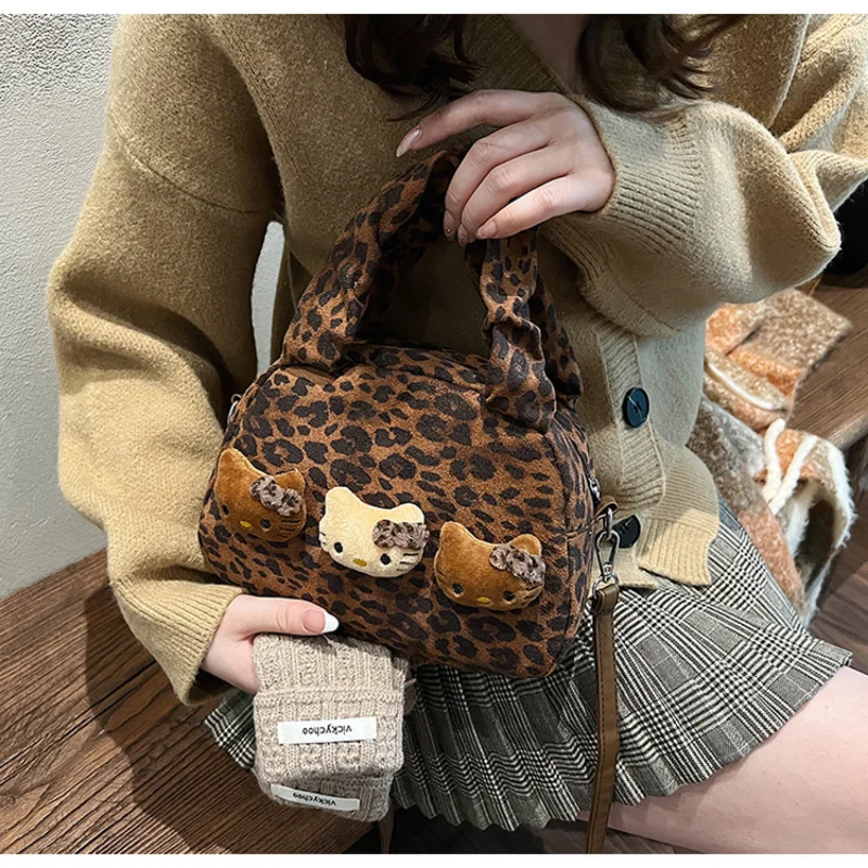 Sanrio hello kitty moda portátil bolsa feminina dos desenhos animados leopardo impressão boneca casual versátil simples bolsa de ombro mensageiro