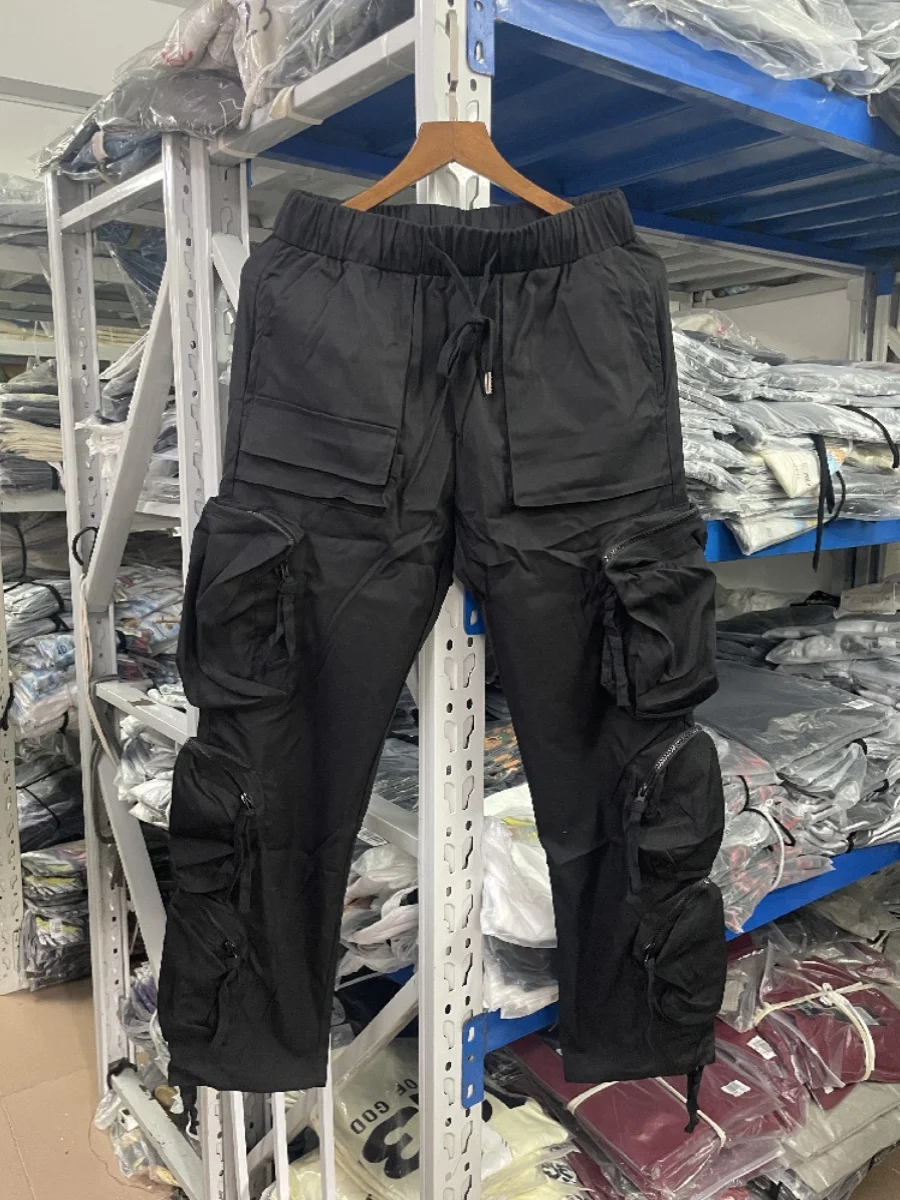 Tendencia de pantalones casuales de tobillo sueltos para hombres estilo American High Street con múltiples bolsillos