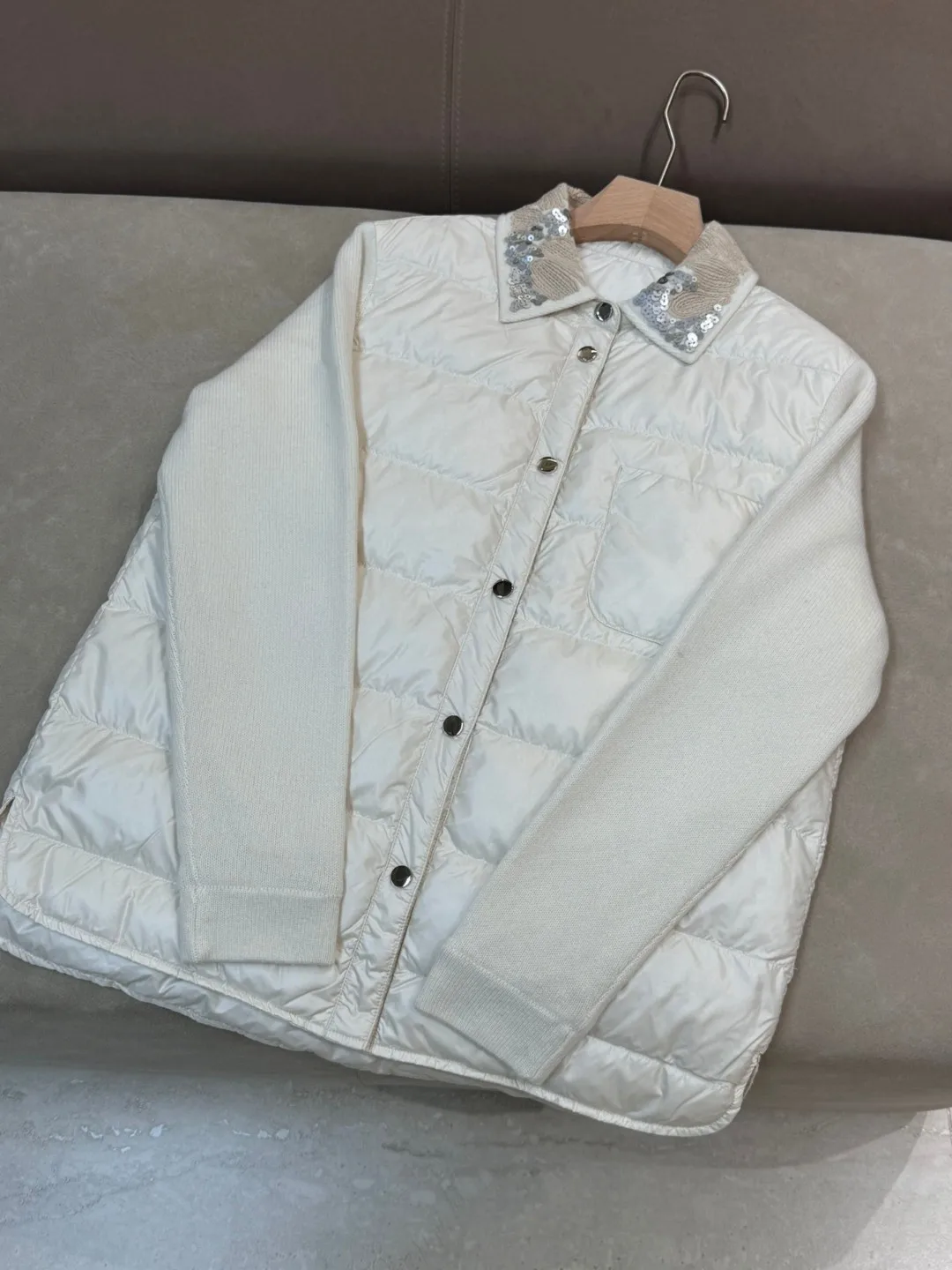 Exquisitely trimmed luxurious solid color down padded single breasted jacket