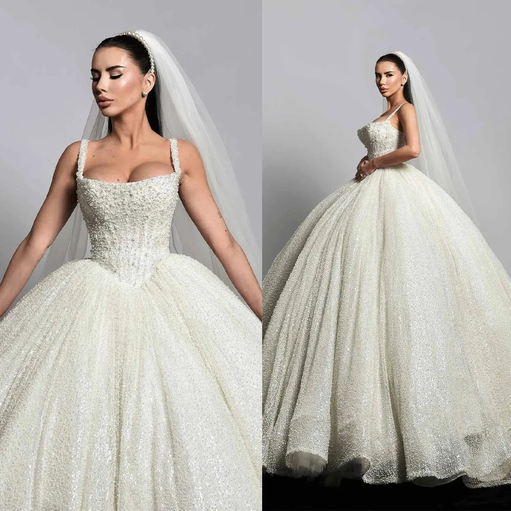 Luxury Ball Gown Wedding Dress Beaded Pearls Spaghetti Strap Bride Gowns Sexy Sleeveless Sweep Train Customized Bridal Dresses