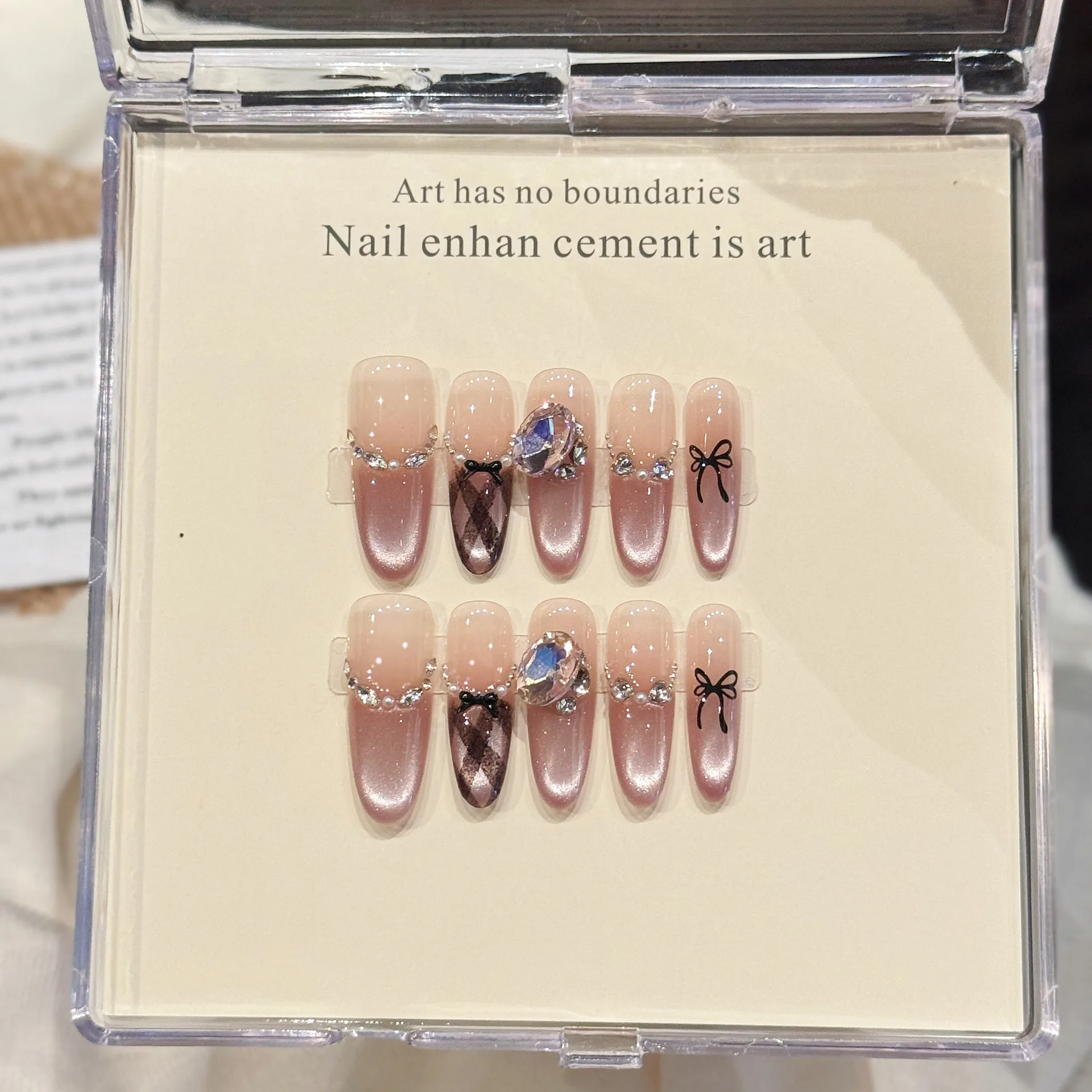 

10pcs Pure Hand Pressed Long Oval Nail Art,Nice Fake Nails,Shiny Pink Cat's Eye With Black Bow And Diamonds,Ideal For Women