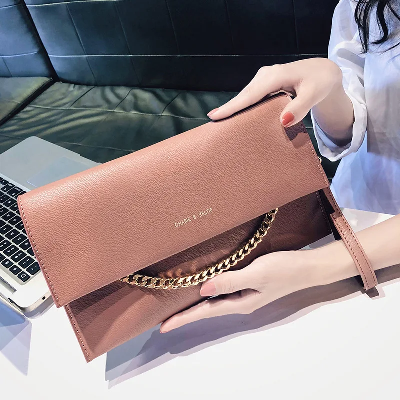 

Women's New Simple Slung Handbag Korean Version of Personality Fashion Joker Temperament and Clutch Bag Girl