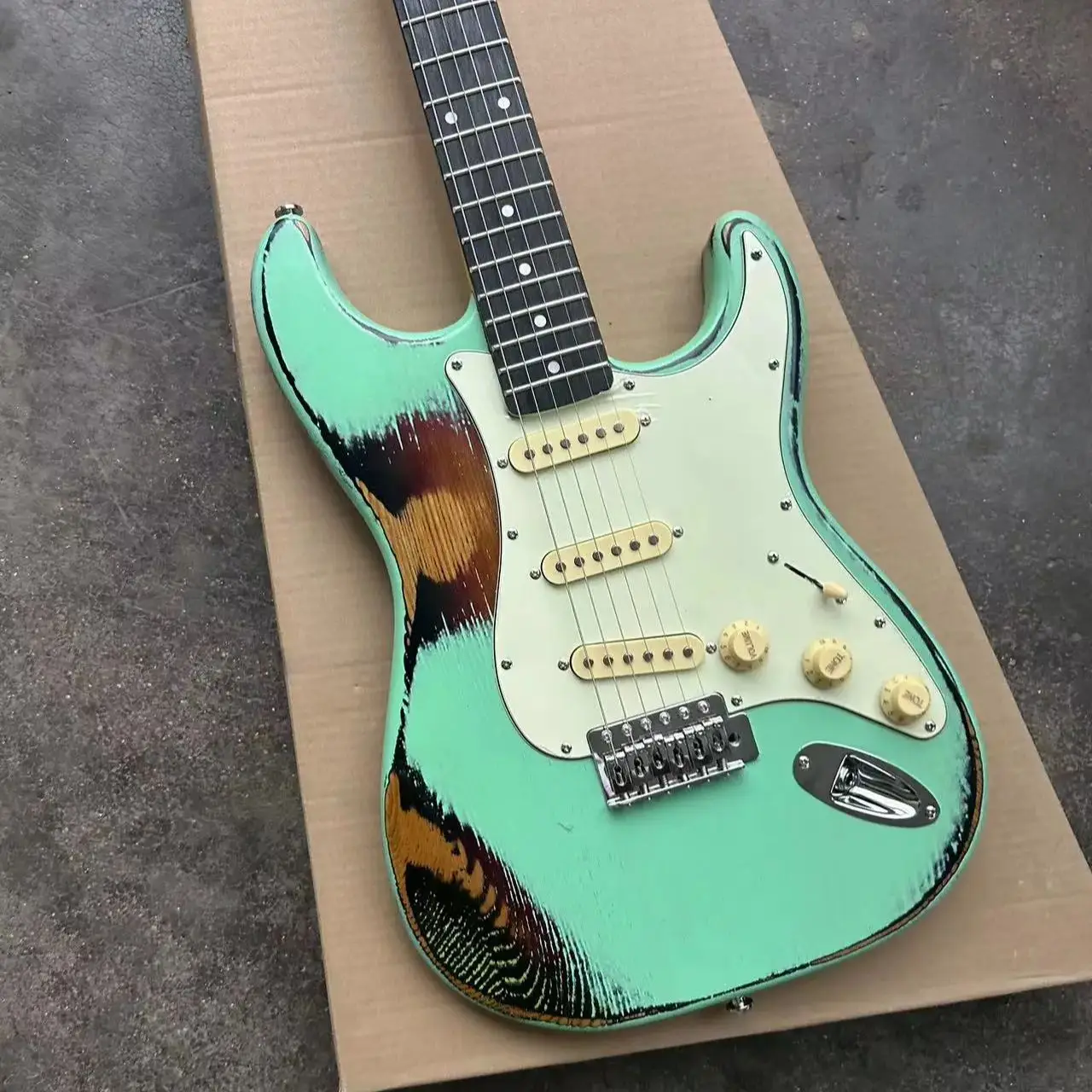 Light green six-string old electric guitar, basswood body, maple neck, white panel to support personalized customization.