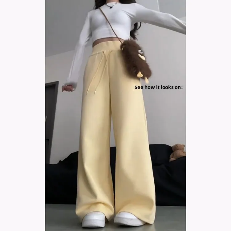 กางเกงฮาเร็มลำลองสีเหลืองนมสำหรับผู้หญิง ฤดูใบไม้ผลิ-ฤดูร้อน 2025 รุ่นใหม่ ช่วยลดเลือนริ้วรอย ทรงหลวมพลิ้ว ช่วยให้ดูผอมเพรียว ทรงกระดิ่ง แฟชั่นเกาหลี...
