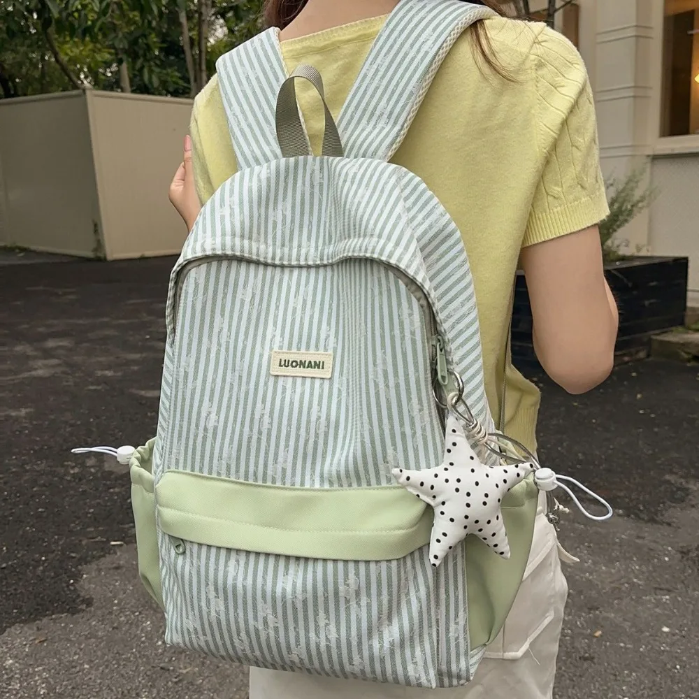 Light nylon cloth stripe collision color student schoolbag lovely pendant large capacity waterproof women travel backpack