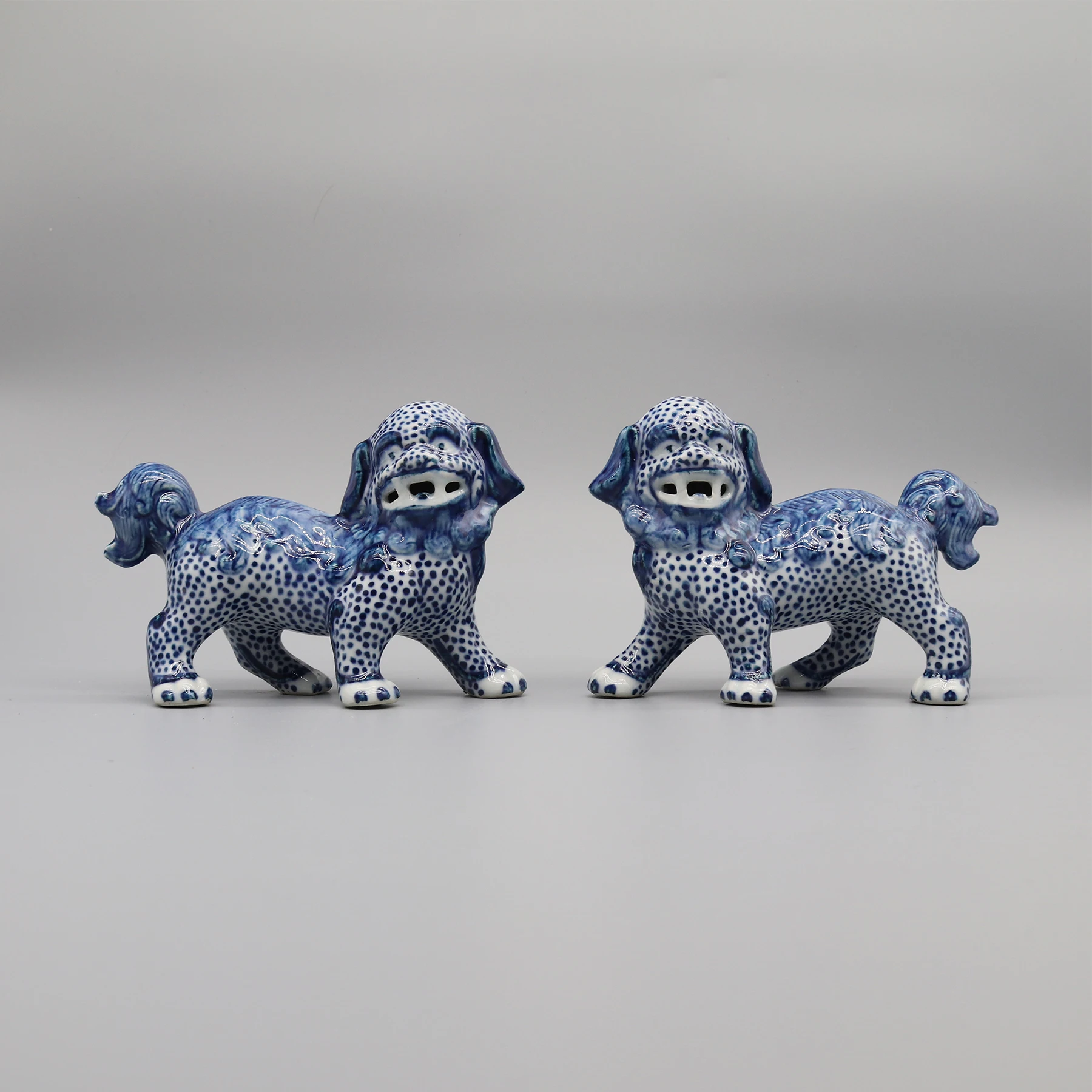 

Pair of Walking Lion Statues, Collectible Blue and White Ceramics, Home Decoration