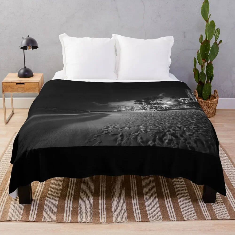 

Beach palm trees and buildings of Waikiki from beach on tropical island night Throw Blanket Bed Large Blankets