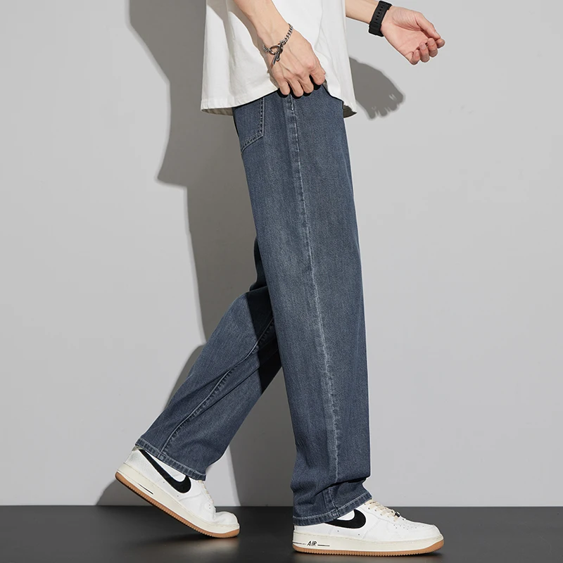 2025 Lyocell verano pantalones vaqueros finos de los hombres de cintura alta sueltos cómodos rectos elásticos pantalones vaqueros de negocios pantalones masculinos