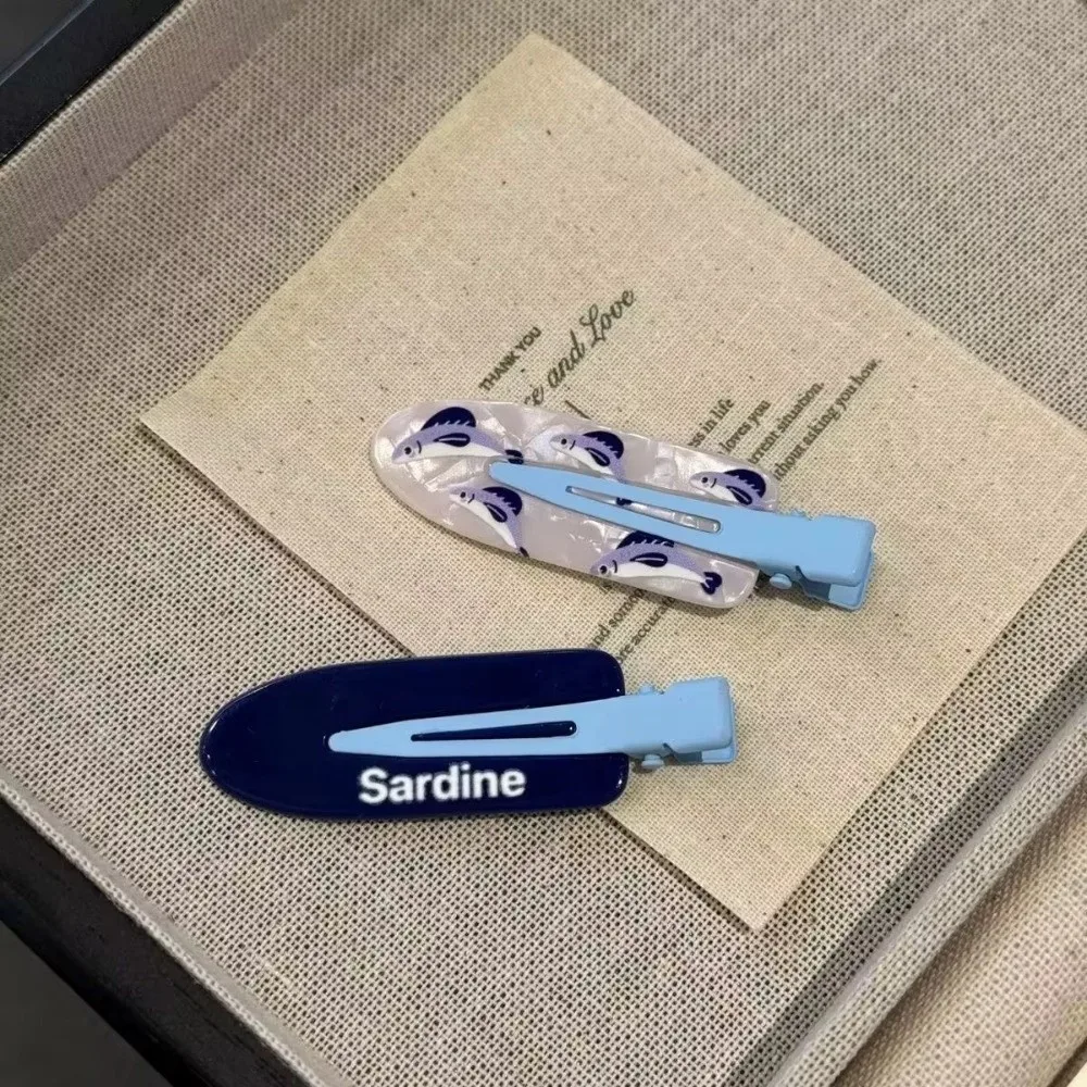 Nouveau mignon dessin animé Sardines pince à cheveux drôle poisson forme acétate matériel frange épingle à cheveux Flyaway pince à cheveux tenue décontracté