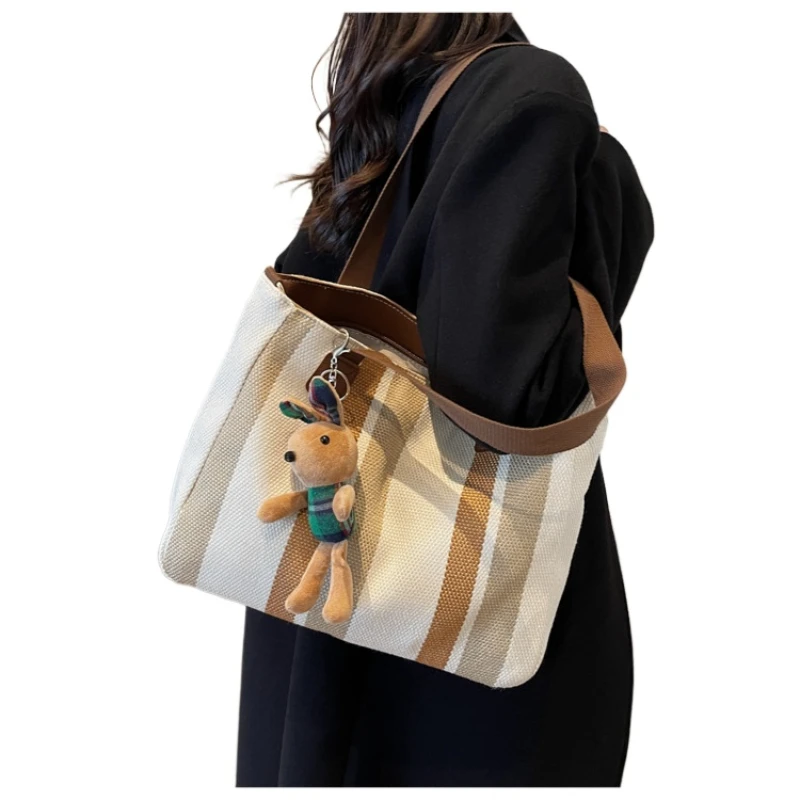

Large bag female 2025 new fashion striped canvas bag commuter tote bag tide single shoulder crossbody mommy backpack