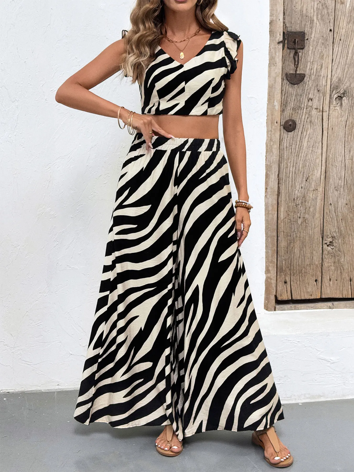 

A black and white zebra print two-piece short top and wide-leg pants set for women is on sale in the summer of 2025