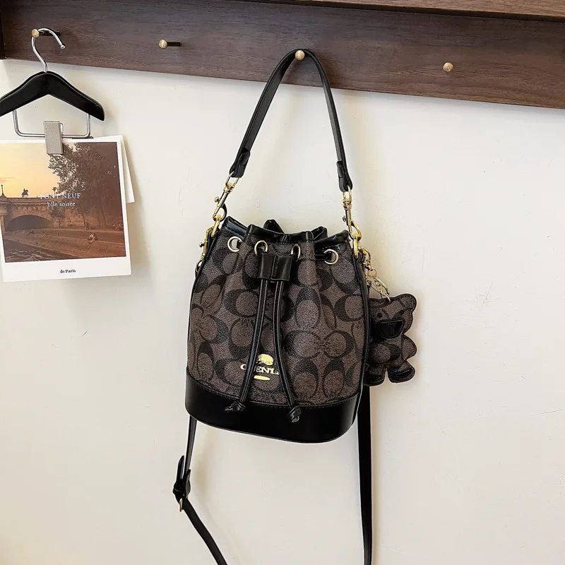 Women Vintage Monogram Mini Bucket Bag, Drawstring Crossbody Purse with Bear Charm, PU Leather Trim Top Handle Shoulder Bag