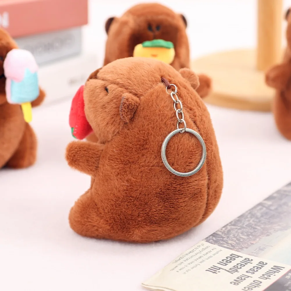 LLavero de capibara de peluche Kawaii, colgante de capibara de simulación de dibujos animados de 12cm, colgante de bolso escolar para tirar de mocos