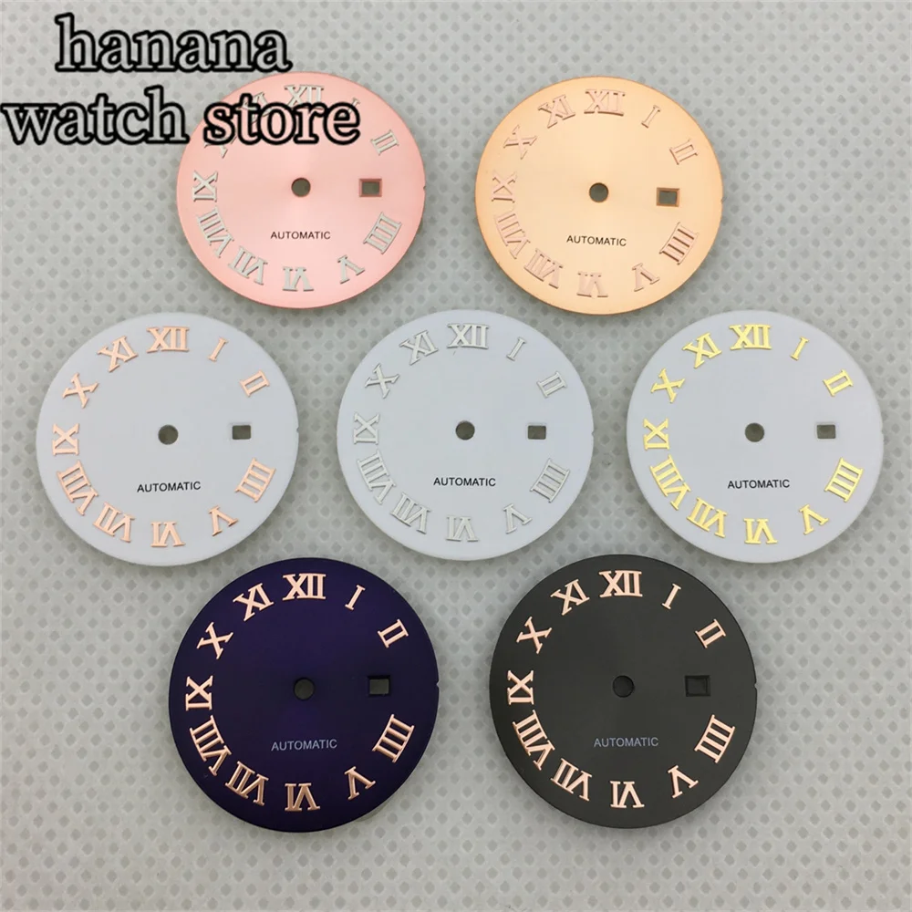 قرص NH05 للسيدات مقاس 24.5 ملم باللون الأسود والذهبي والوردي ومينا للتعرض اليومي باللون الأبيض اللامع مع مؤشر روماني يدوي مناسب لحركة NH05