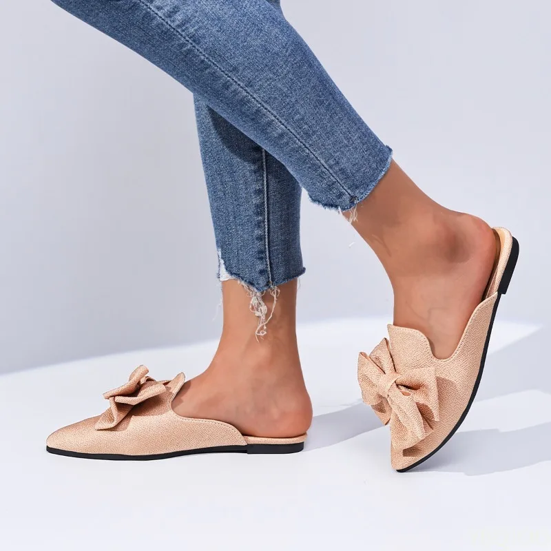 شباشب نسائية عصرية مدببة مع تصميم زخرفة فيونكة ضحلة شبه مقاومة للانزلاق أحذية نسائية فاخرة مسطحة القاع