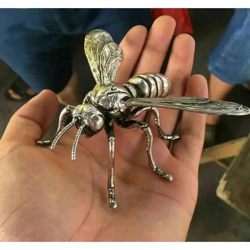 

Hand sculpture of the Miao silver statue, realistic dragonfly