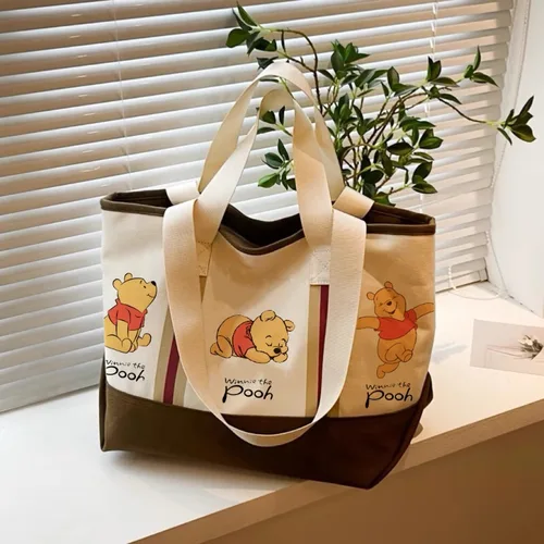 Imagen 2 del producto Disney 2026 nuevo bolso de mano Winnie The Pooh para mujer, bolso de lona a la moda, bolso informal de gran capacidad para mujer