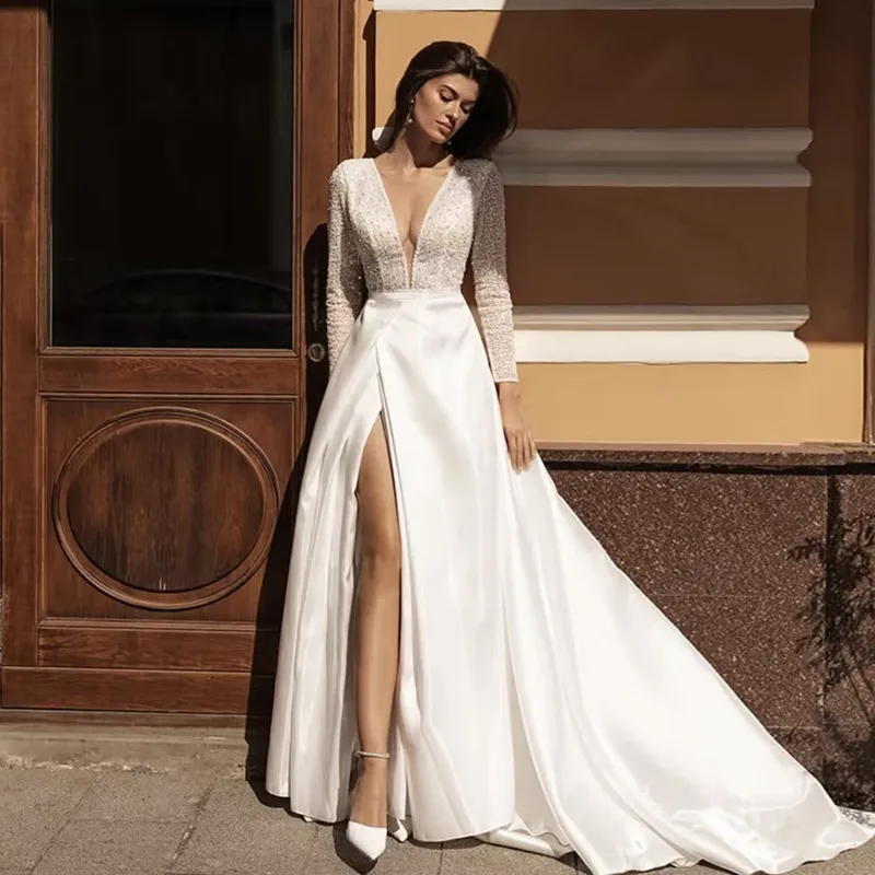 Luxyry A-Line Abito da sposa Lucido con perline Paillettes Piega Maniche lunghe Sexy Profondo scollo a V Backless Abiti con spacco laterale alto Personalizzato