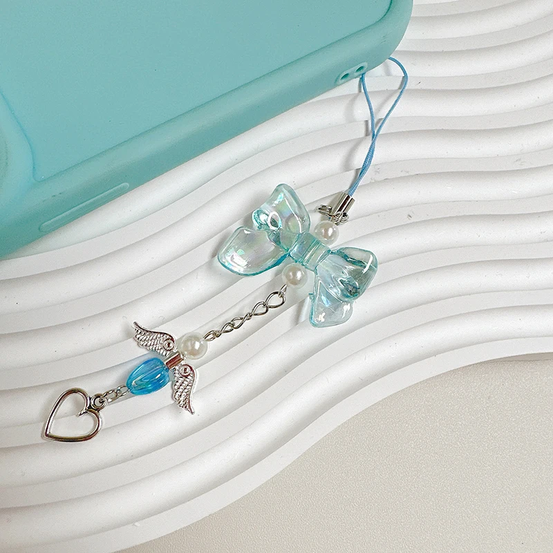 สายโซ่คล้องโทรศัพท์รูปโบว์ Y2k หวานปีกนางฟ้าน่ารักจี้รูปหัวใจเคสสายคล้องคอป้องกันการสูญหาย