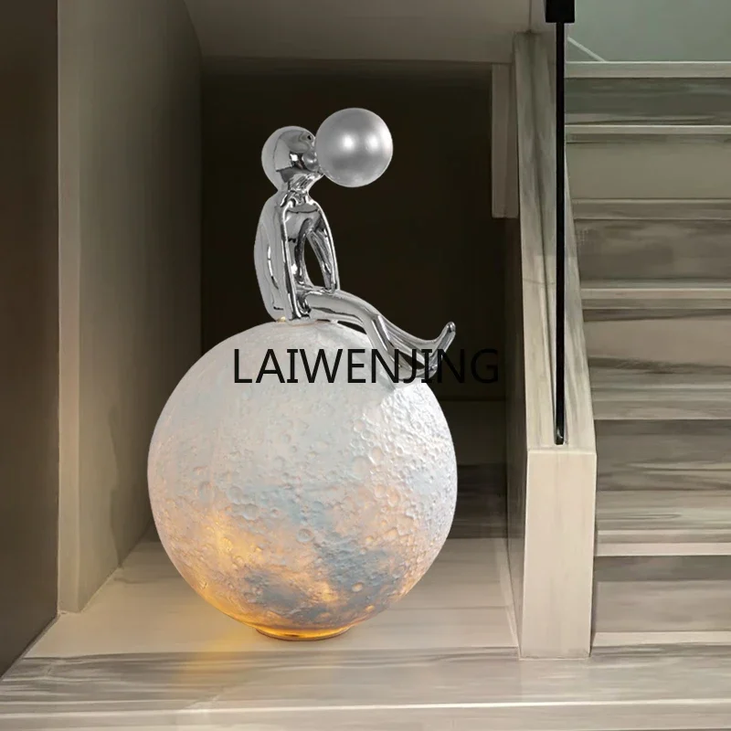 Floor-to-ceiling ornaments under SGF stairs Entrance Moon blowing bubble figure sculpture