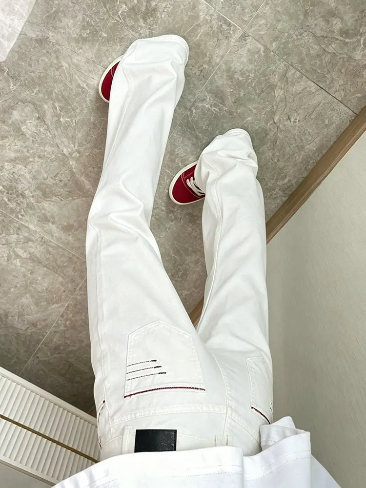 Cleanfit Mens White Embroidered Slim Fit Jeans Four Thread Stitching High Street American Vibe Curved Knife Pants Micro Flared