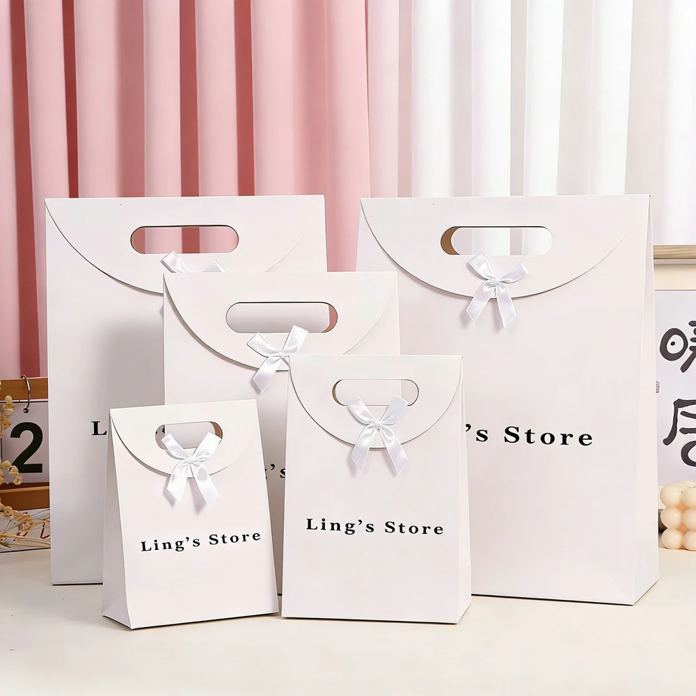 

24/50/100pcs Custom Logo Jewelry Gift Flap Bowknot Bag Souvenir Paper Pocket Accessory Packaging Birthday Perfume Boutique Pouch