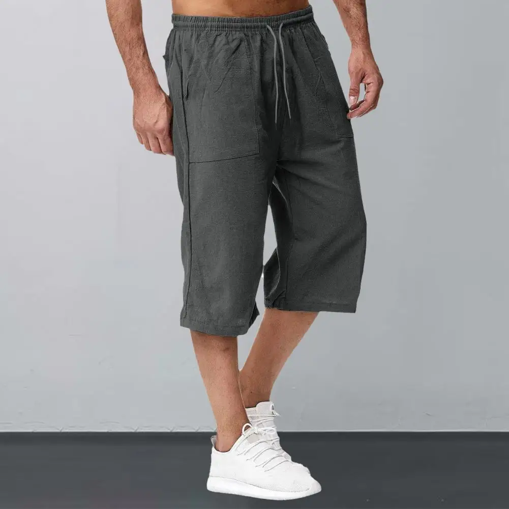 

Men Cropped Pants Men Ergonomic Design Pants Men's Mid-rise Elastic Drawstring Wide Leg Pants with Pockets for Summer Streetwear