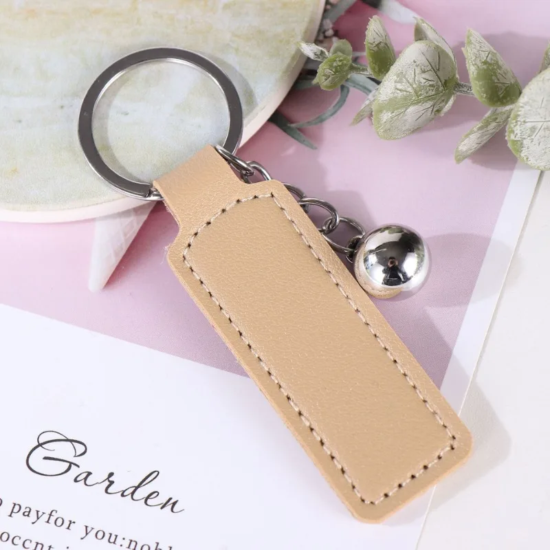 โลโก้ที่กําหนดเองพวงกุญแจเปล่า PU หนังเลเซอร์แกะสลักพวงกุญแจรถอุปกรณ์เสริมหลายสีส่วนบุคคล Key Chains