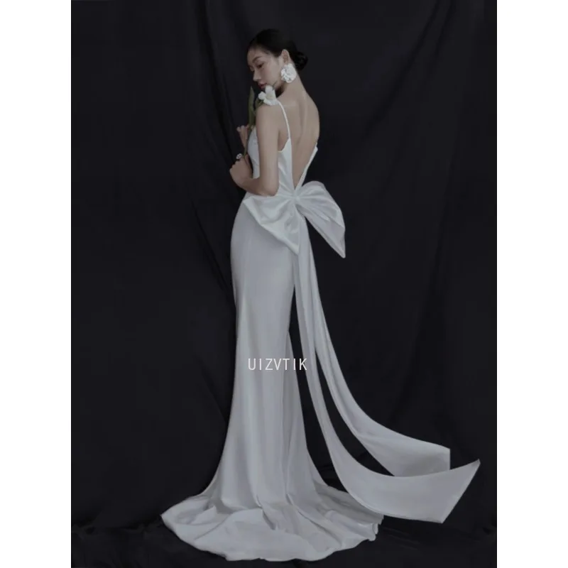 

White Simple Korea Mermaid Wedding Dresses with Big Bow V Neck Spaghetti Strap Party Dress Sweep Train Open Back Bride Gowns