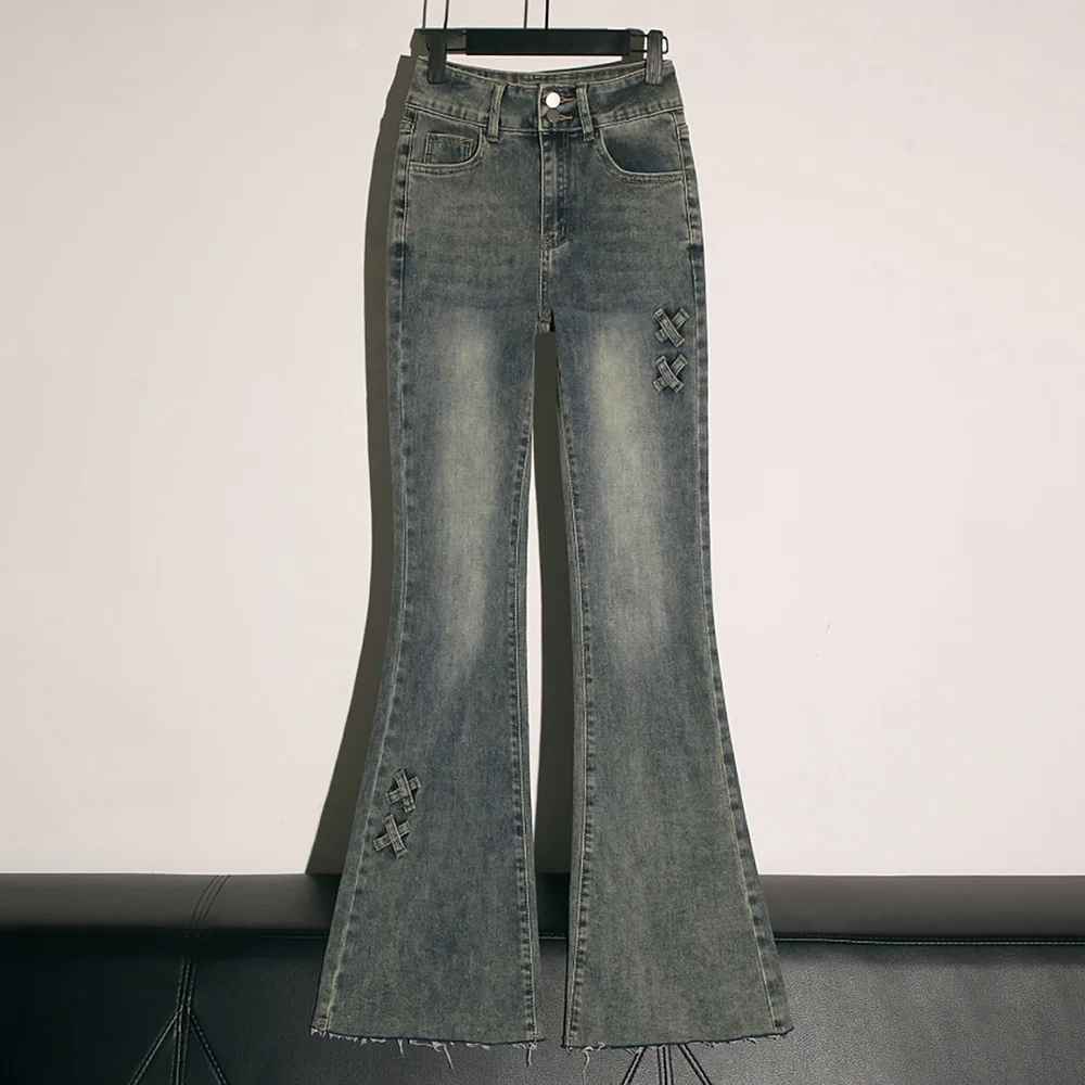 Retro blauwe slanke uitlopende jeans dames oversized Amerikaanse stijl hoge taille bandage boog ontwerp jeans denim broek met klokbodem