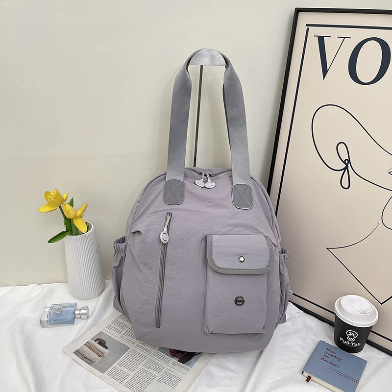 

Nylon Solid Color Zipper Fashion Backpacks 2026 New High Capacity Commuting Bags Simple Casual Durable Women's Handbags