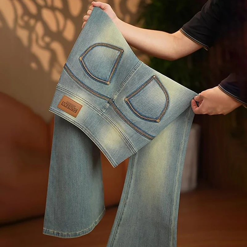 

Новинка 2023 года, женские расклешенные джинсы, потертые синие джинсовые брюки в стиле ретро, стильный дизайн с карманами, модные повседневные брюки, модные узкие джинсы