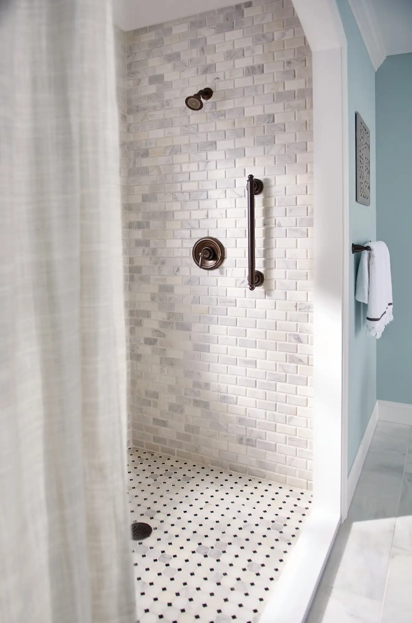 Brantford Posi-Temp Shower Set with EasyClean Showerhead The spout enhances the camber of the faucet body and handle