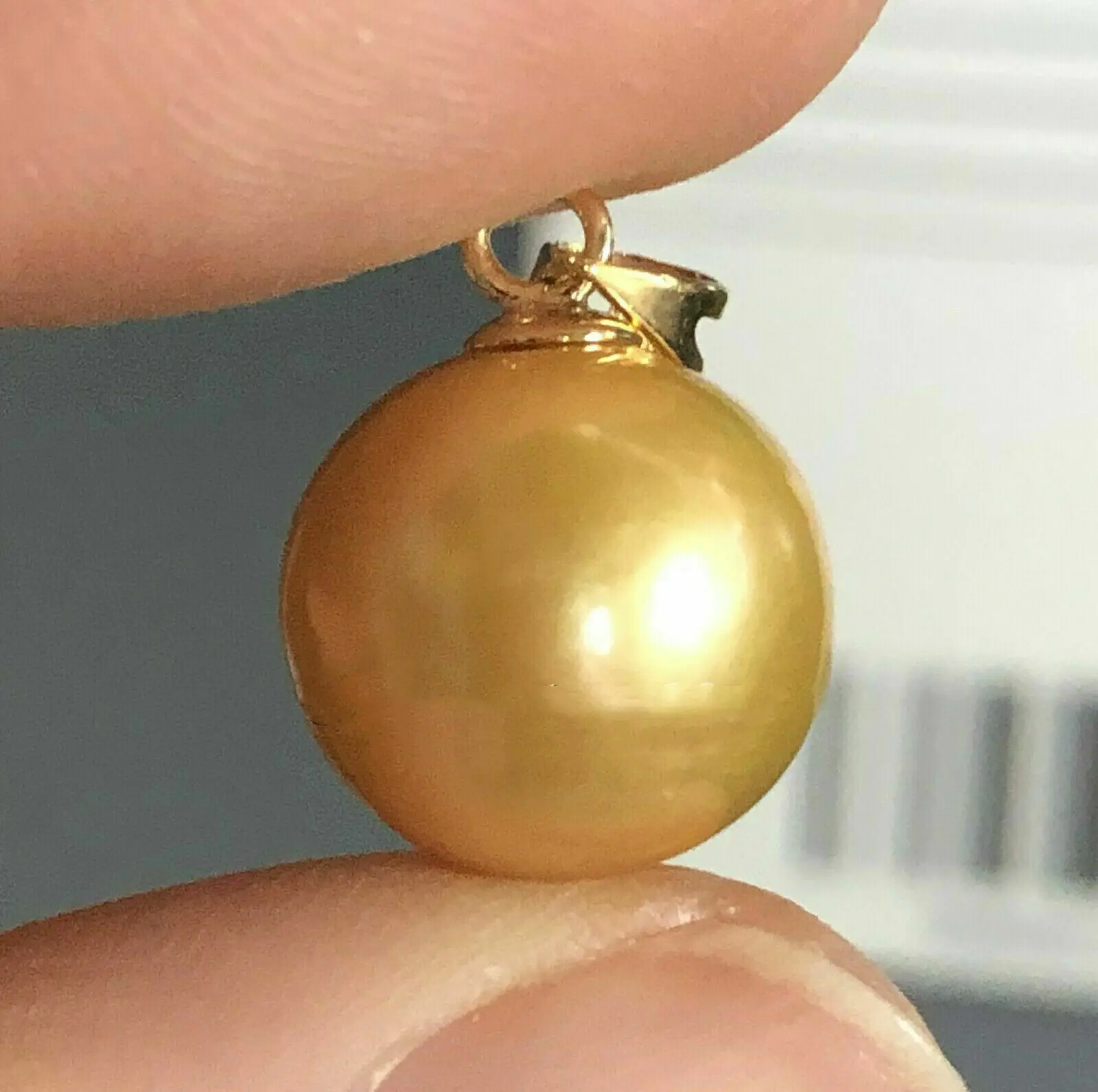 

Gorgeous large AAAA 11-12mm natural South China Sea gold round pearl pendant 14k gold