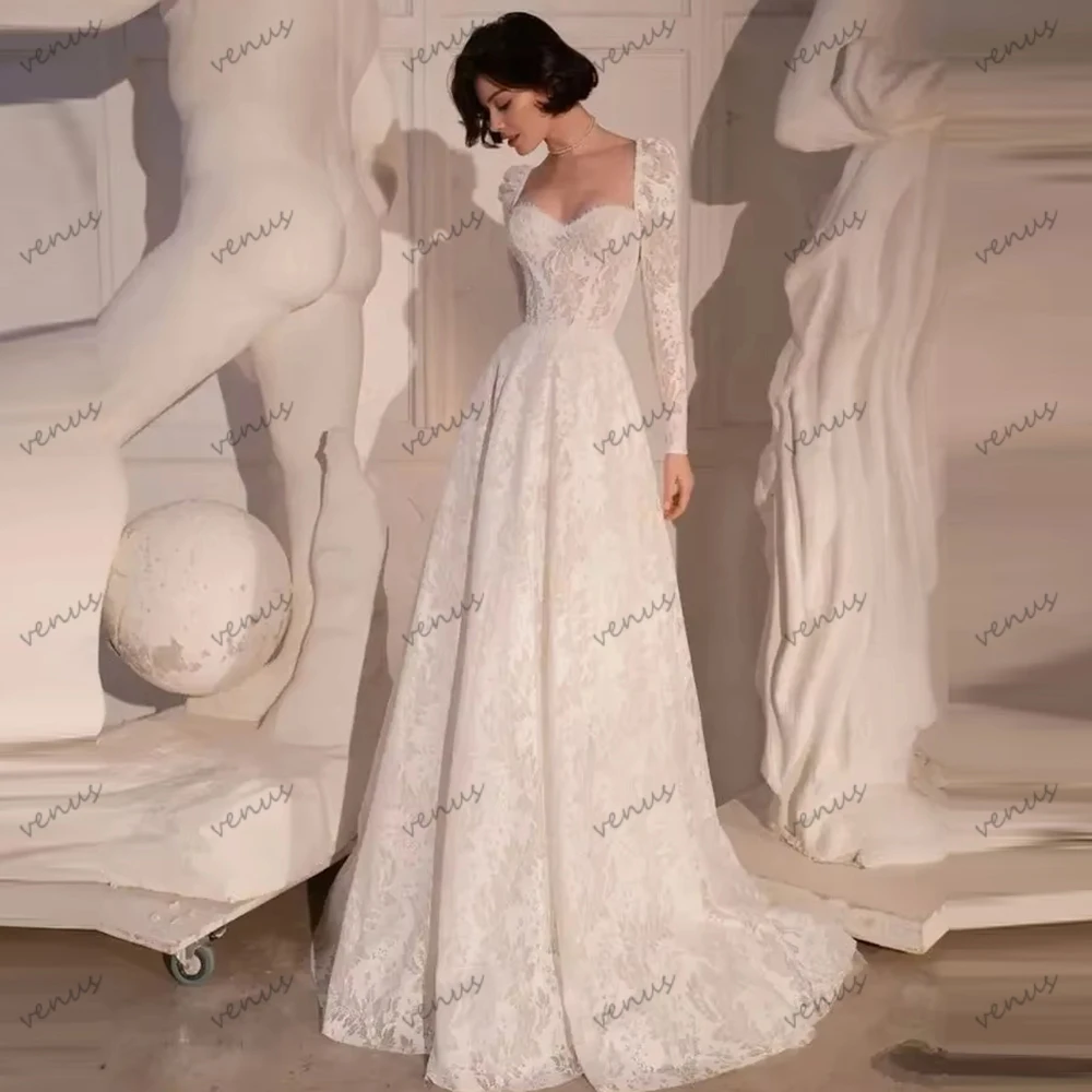 ชุดแต่งงานโบฮีเมียนทรงเอไลน์ ชุดเจ้าสาวลูกไม้แบบมีชั้น แขนยาว ยาวกรอมพื้น สวยงาม ชุดแต่งงานแบบสั่งตัด