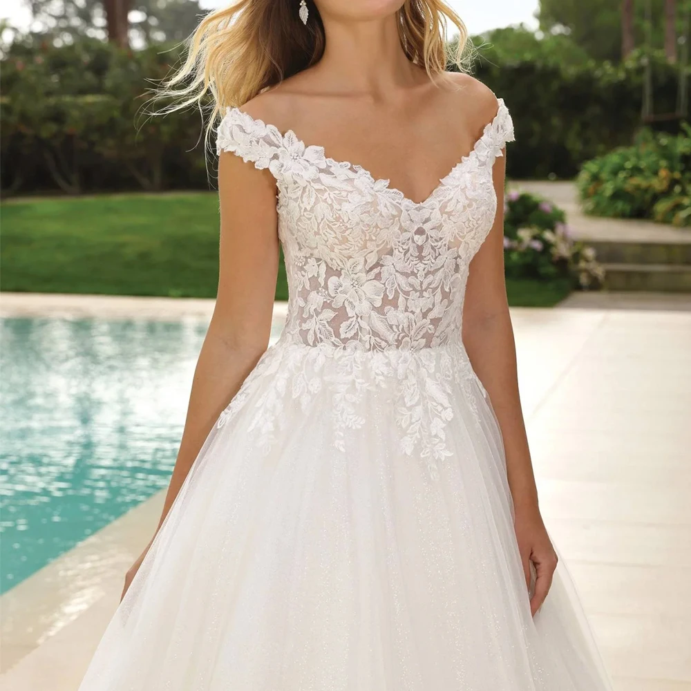 Abiti da sposa personalizzati con spalle scoperte Scollo a V Abiti da sposa con applicazioni in pizzo Illusion Ball Gown Lunghezza pavimento Tulle Vestido de novia