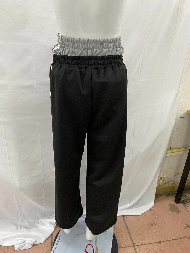 Double waisted fake two-piece long pants with dark Gothic embroidery pattern, color blocked fashionable couple