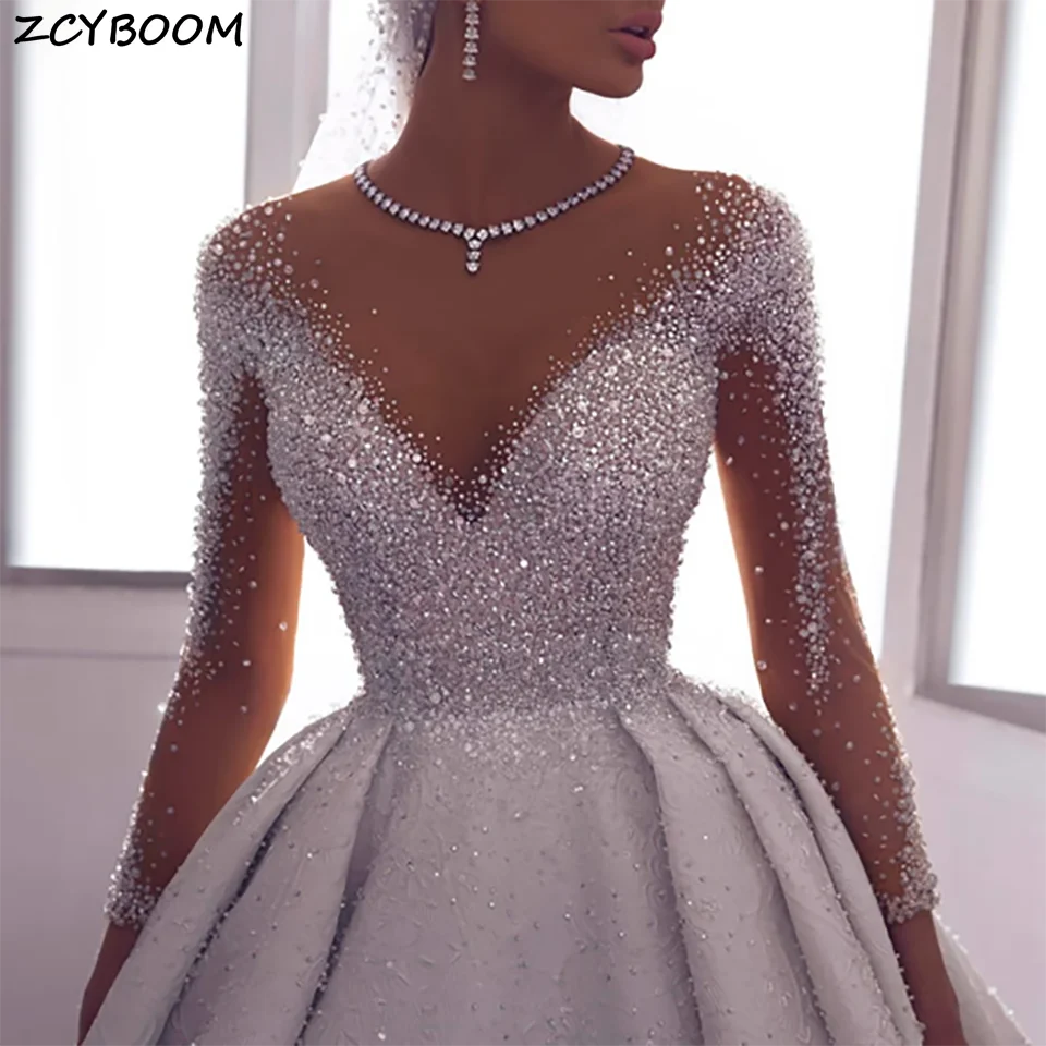 Luxurious Rhinestone Beaded O Neck Ball Gown Wedding Dresses 2024 Illusion Open Back Tulle Arabic Dubai Bridal Gowns For Women