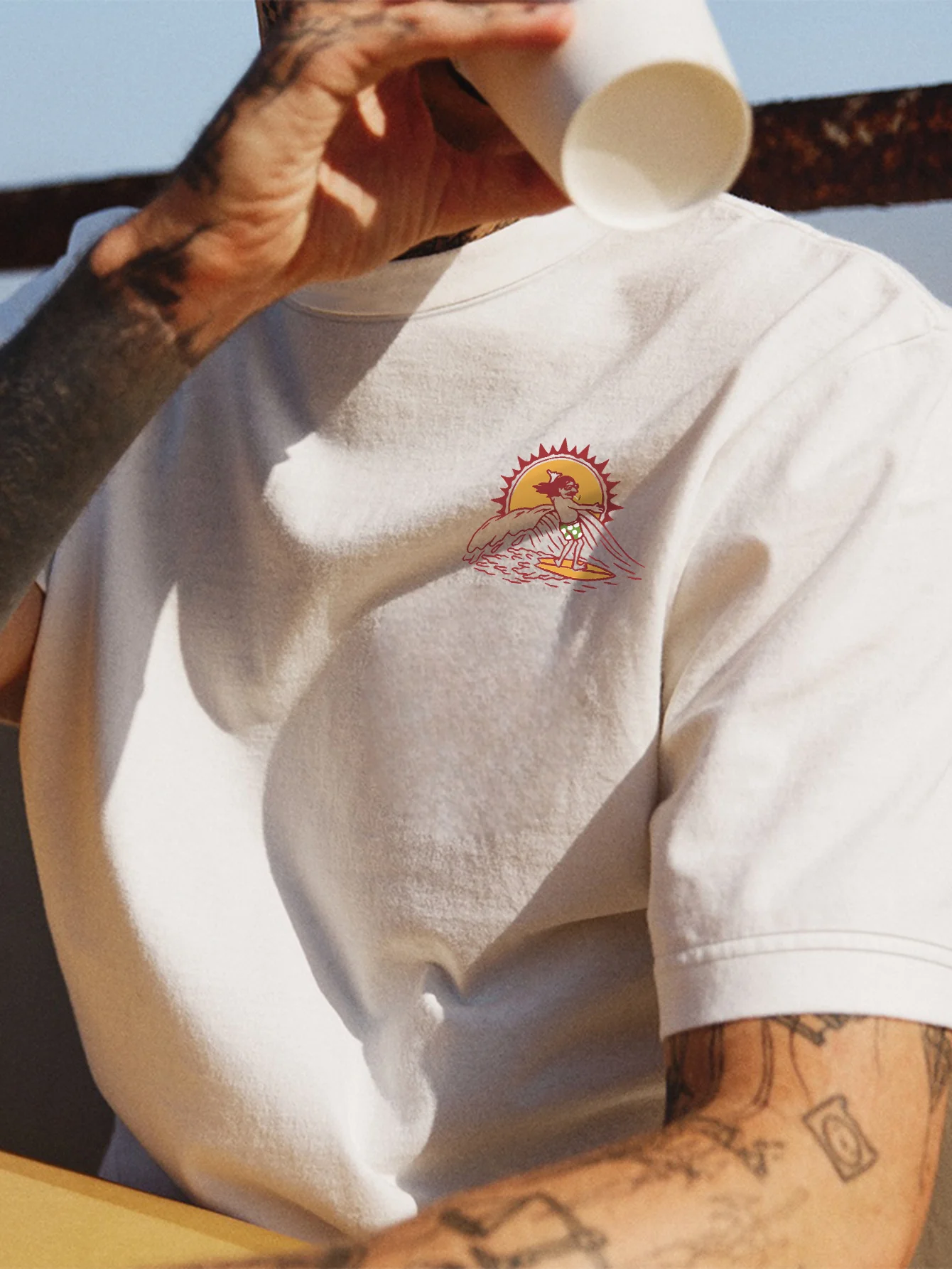 

Men's 100% cotton short-sleeved T-shirt, geometric surfing and sunshine design, printed by riding high two joints company.