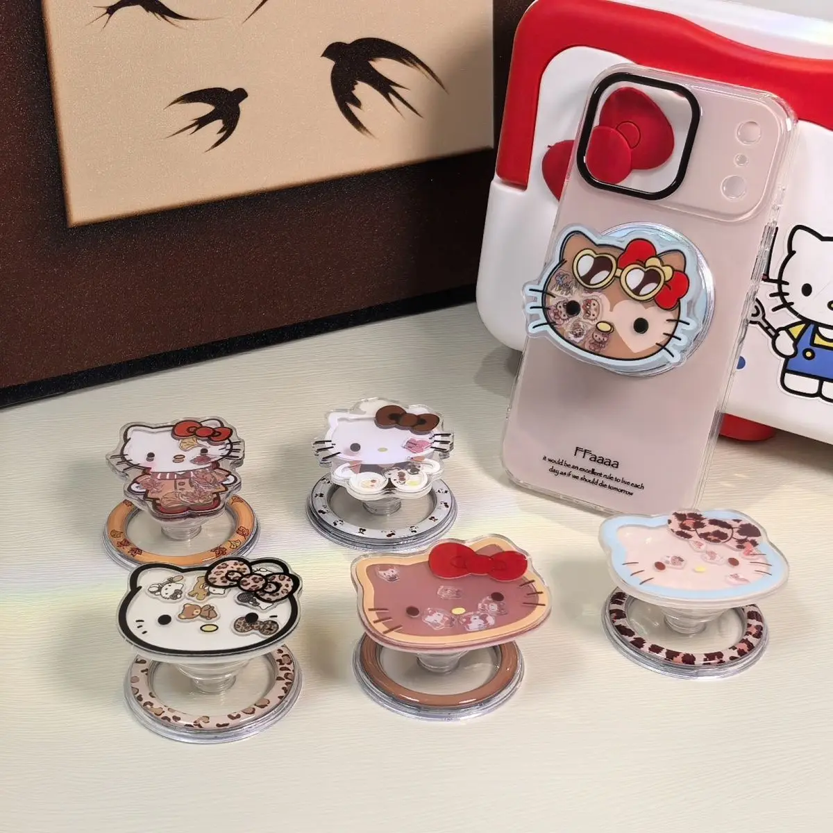 

Hello Kitty Cartoon Cute Leopard Print KT Pattern Rocker Adsorption Magnetic Stand Removable and Telescopic Cell Phone Accessory