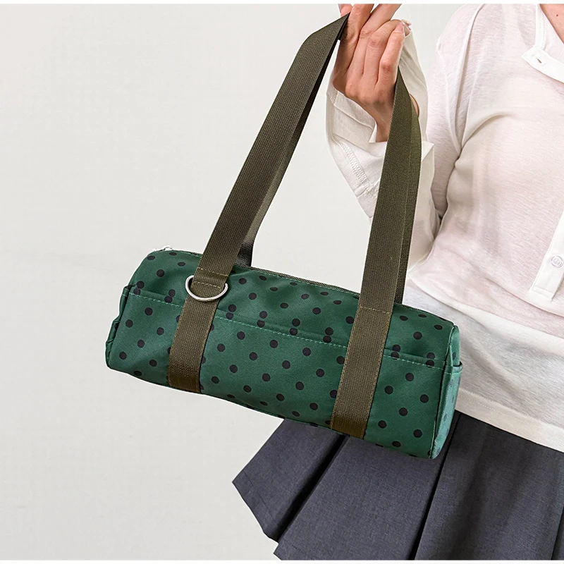 Gepunktete Schultertasche in langem Zylinderformat, Damen-Handtasche mit Tragegriff, zylindrische, leichte, schicke Tragetasche für den Arbeitsweg – Detail 17