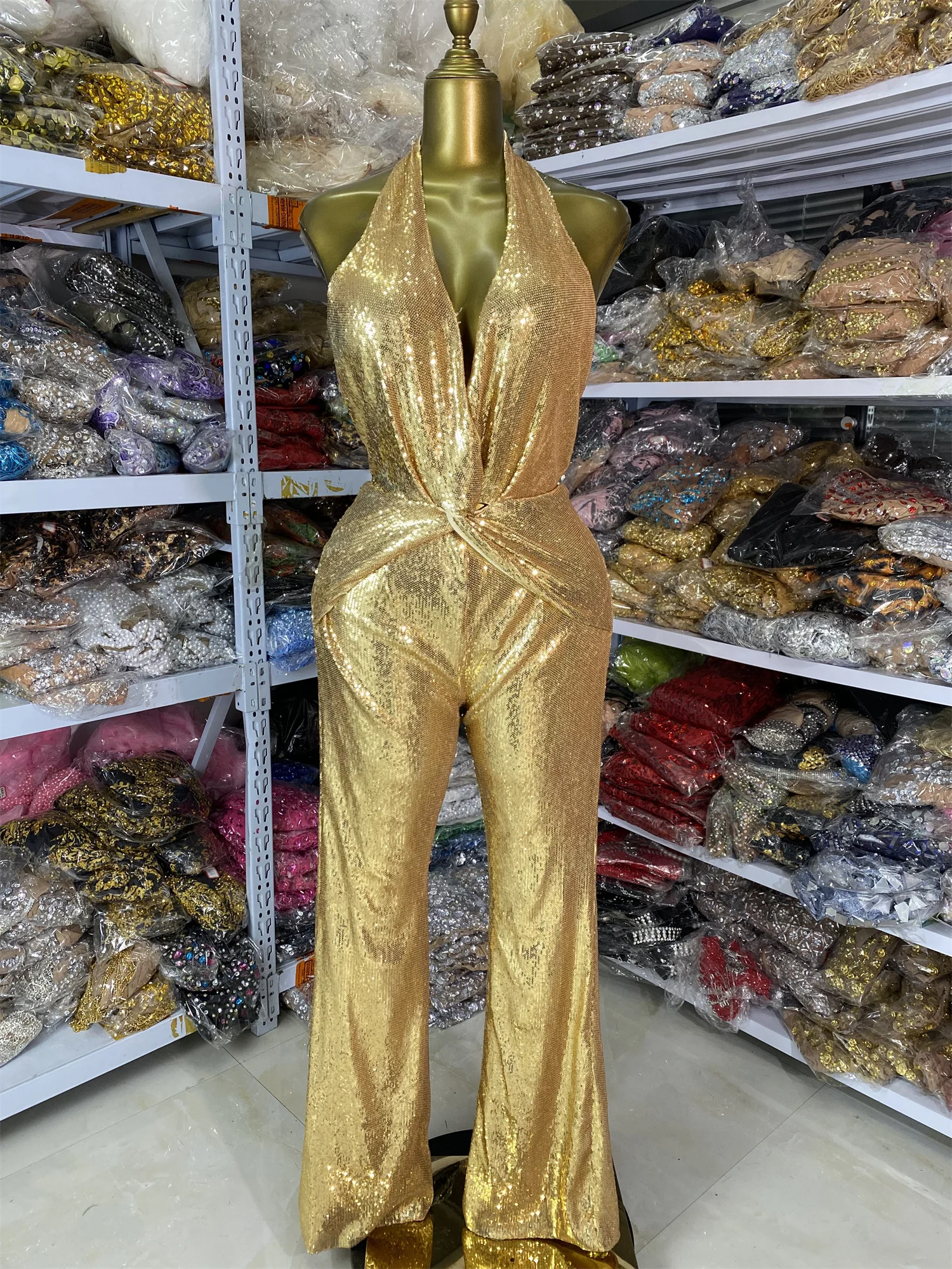 

Женский блестящий комбинезон с блестками в стиле панк, бретелька с глубоким v-образным вырезом и открытой спиной, расклешенные брюки, уличная одежда, сценические костюмы для ночного клуба