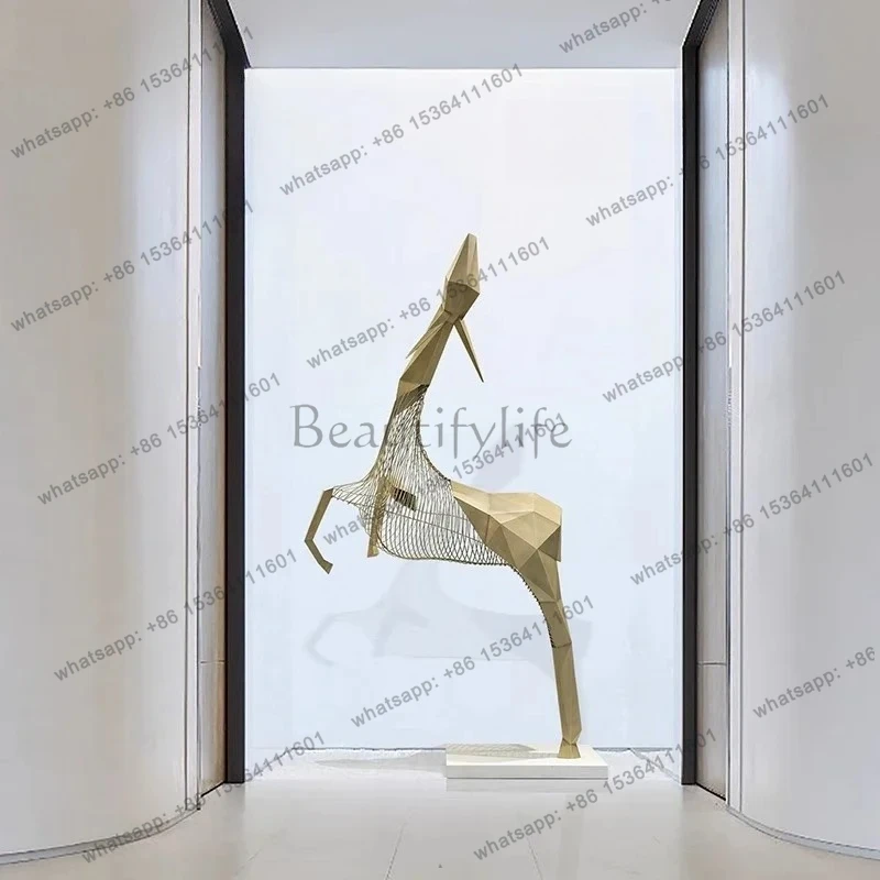Stainless steel abstract deer sculpture, large floor-to-ceiling installation at the front desk of the sales hall