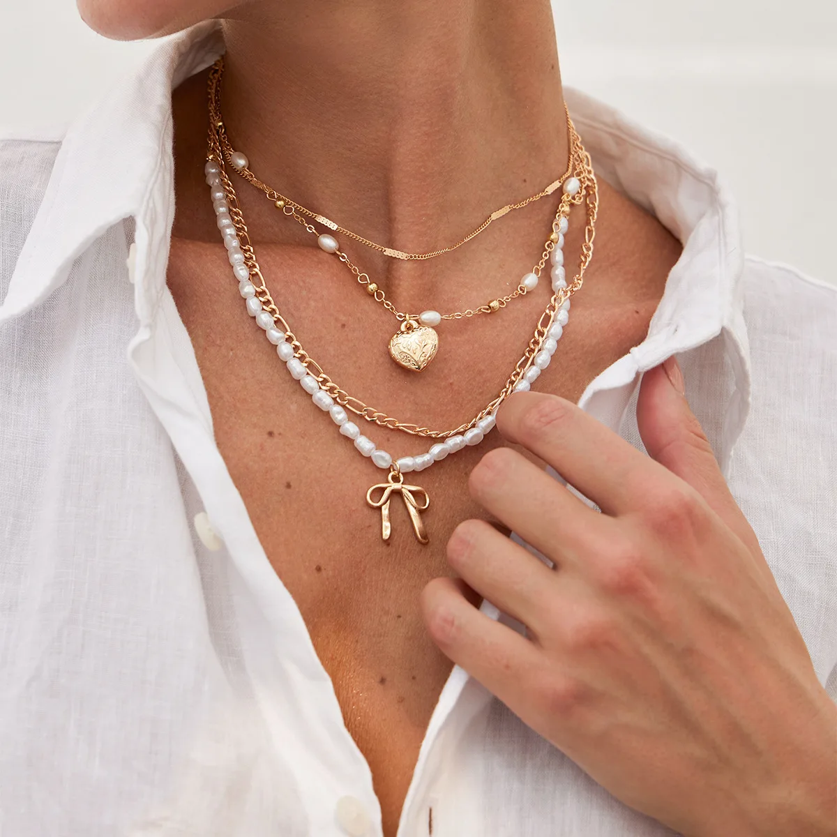 Wind multi-layer stacked necklace women's long high-end love bow necklace cross collarbone chain